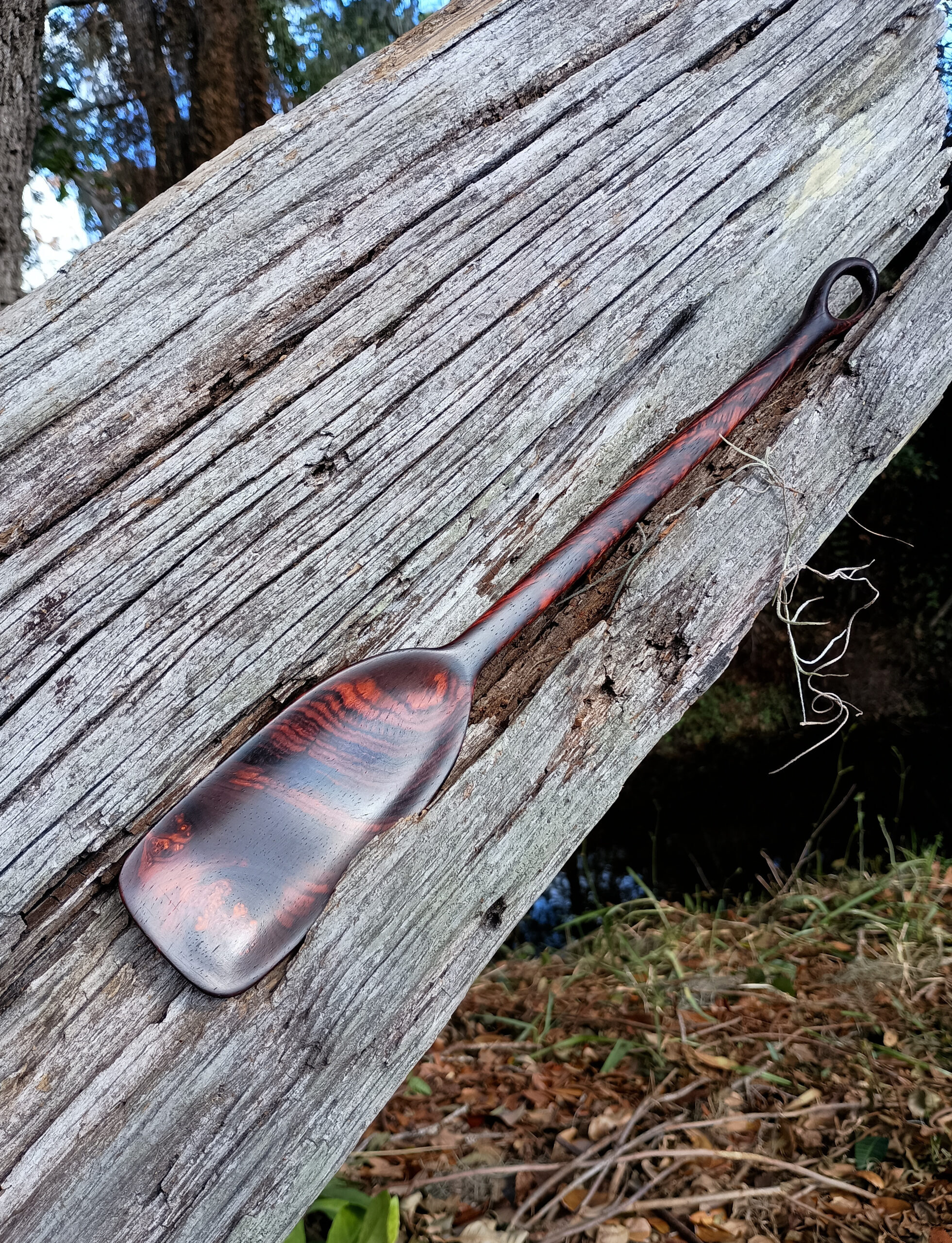 Handmade spatula made of slightly burled cocobolo with loop carved on handle end. Made for John the Machinist. Sarasota, FL