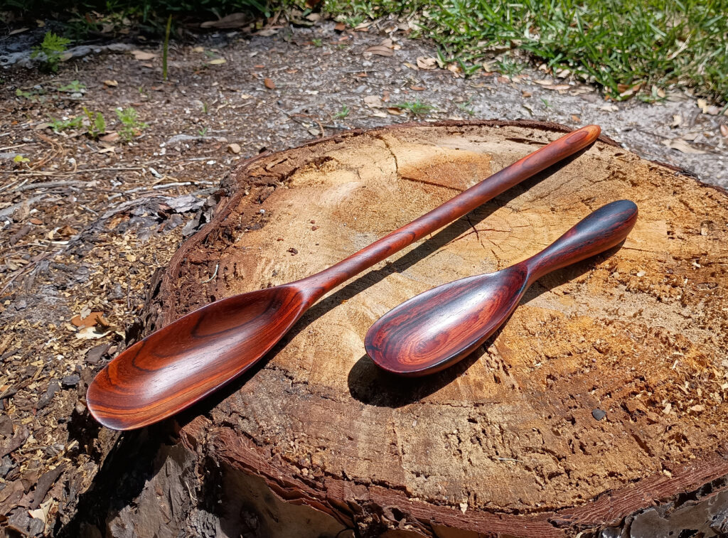 View 2: Two handmade cocobolo spoons. The large one is 16.5 inches and the short one is 8.25 inches. Both made on 04-19-2025