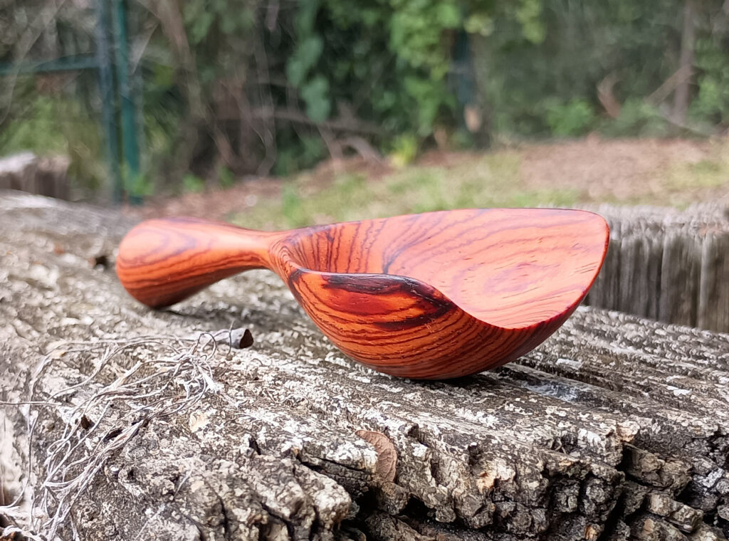 Handmade coffee scoop made of cocobolo wood. Front view. Made 05-10-2025