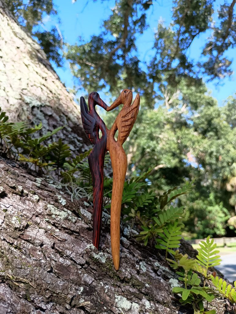 Handmade hairpin - tribute to the sandhill crane. Carved of variegated sapwood and heartwood. 08-08-2025 Sarasota, FL