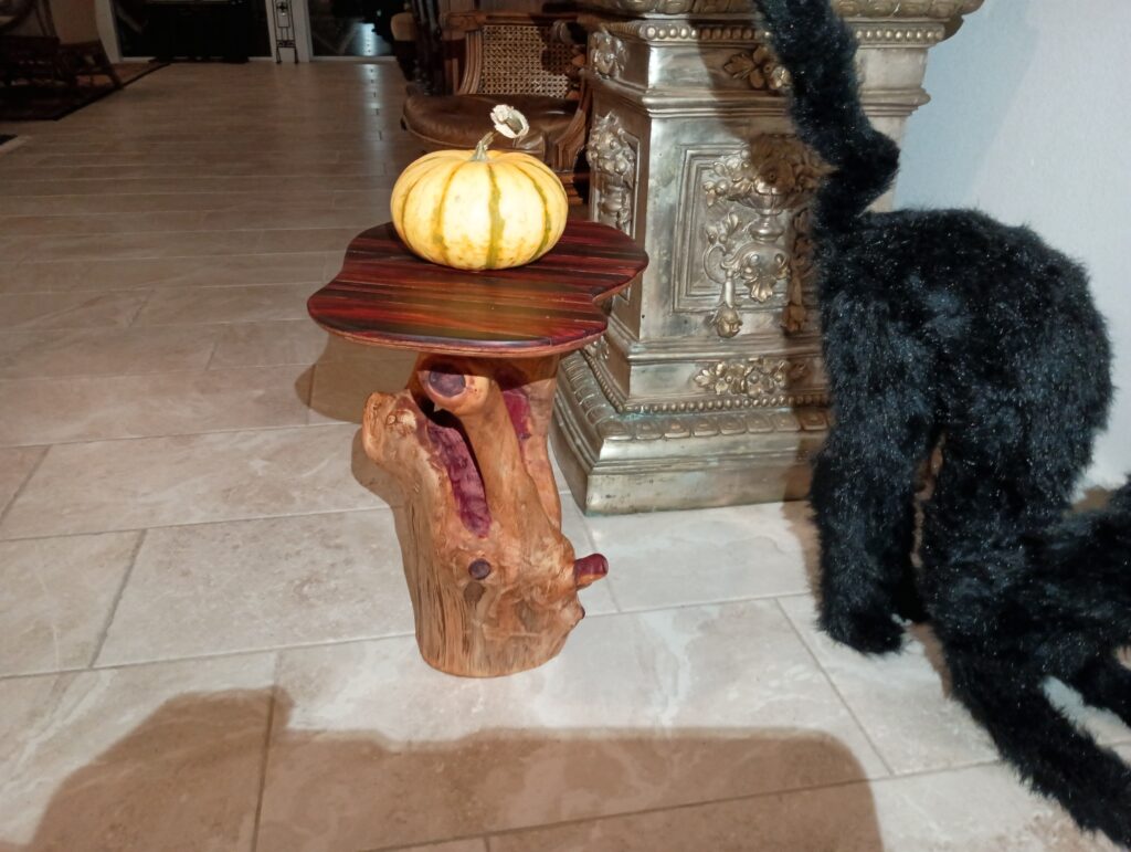 Finished table carved & hollowed from solid cedar log, with cocobolo top
