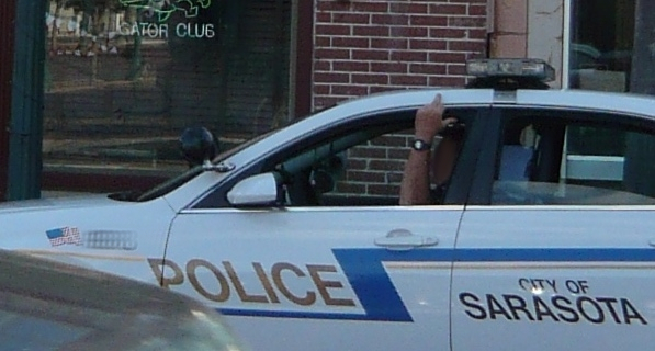 Sarasota Police Officer Gives Middle Finger To Photographer
